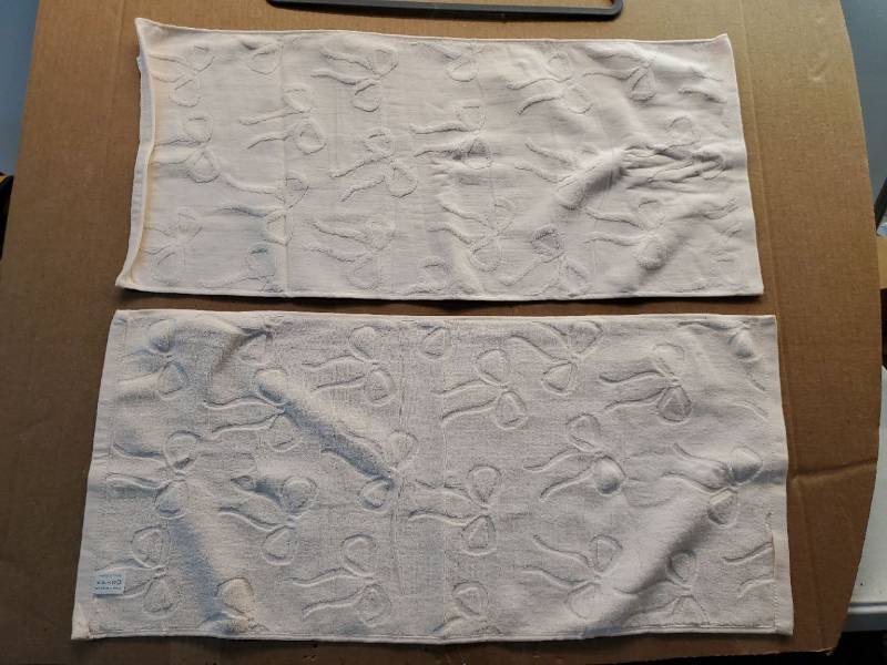 lot 38057 image: Bow Embossed Baby Pink Hand Towels Set of 2 - Retail $12