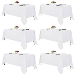 lot 38675 image: 6 Pack White Table Cloths 70x120 Inch for 6-8 Ft Rectangle Tables - Retail $48