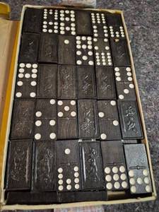 lot 75 image: Dominoes Set 28 Tiles Double-Six Black Wood with Monkey Design Box