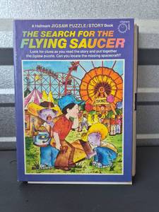 lot 129 image: Hallmark The Search for the Flying Saucer Jigsaw Puzzle Story Book 110 Pieces