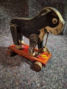 lot 169 image: Pull Toy Horse on Red Wheeled Platform
