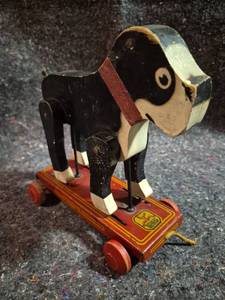 lot 171 image: Hustler Toy Corporation Pull Toy Dog on Wheeled Platform