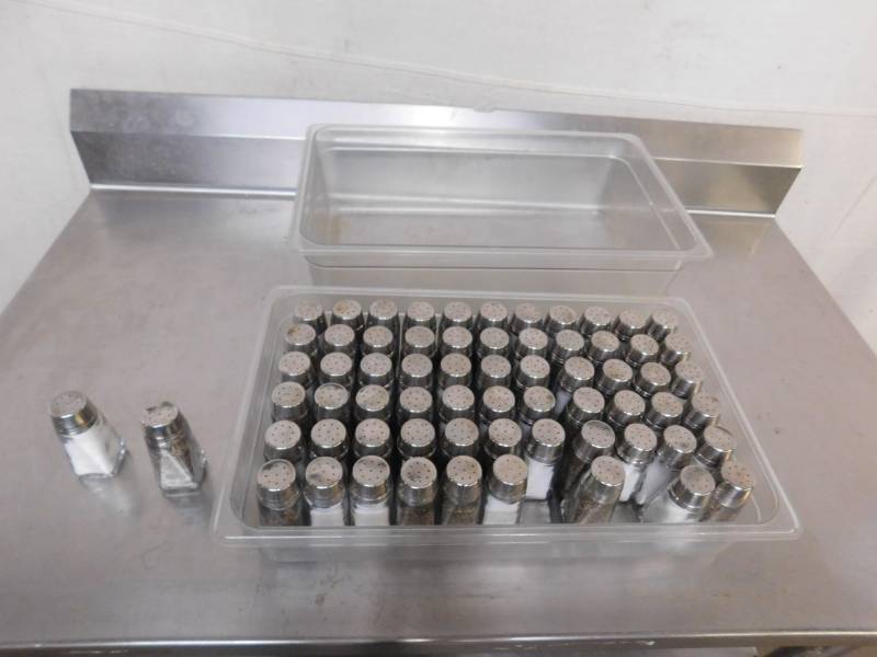 lot 729 image: 66 Salt & Pepper Glass Shakers and 2 Plastic Pans