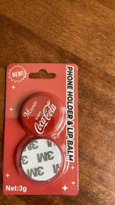 lot 175 image: Coca-Cola Phoneholder &amp Lip Balm 3g -&nbsp