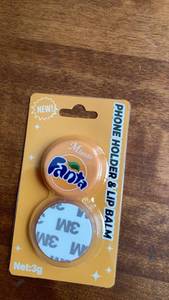 lot 180 image: Mundo Ado Phone Holder &amp Lip Balm 3g -&nbsp