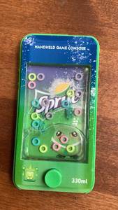 lot 245 image: Sprite Handheld Game Console 330ml -&nbsp