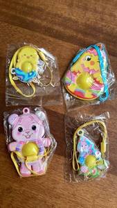 lot 337 image: 4-Piece Toy Character Keychains with Yellow Ball popit Charms -&nbsp
