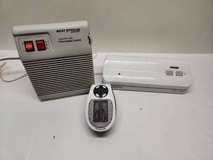 lot 19 image: Heat Stream HeaterFan with Thermostat Control, FoodSaver Vacuum Sealer, and Space Heater Lot