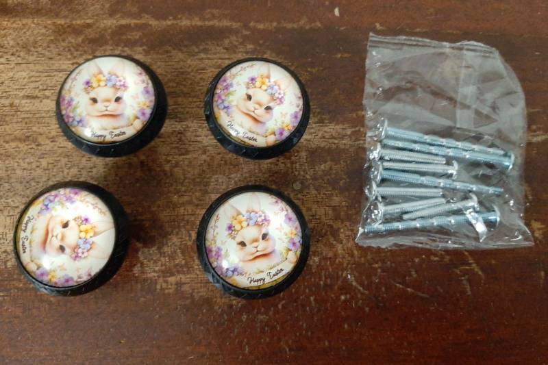 lot 16826 image: 4 Pack Bunny with Happy Easter Ribbon Cabinet Knobs Round Drawer Pulls Black Dresser Knob Cupboard Door Handles Hardware for Kitchen Bathroom Cabinets - Retail $18