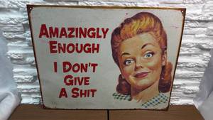 lot 63 image: Amazingly Enough I Dont Give A  Metal Sign (12.5x16)