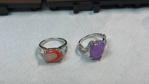 lot 109 image: 2 Stone Rings - Red Orange & Purple Oval Cabochon