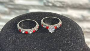 lot 138 image: Wedding & Engagement Ring Set - 2 Rings with Red and Clear Stones