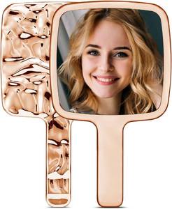 lot 2160 image: MIRRORNOVA Handheld Mirror, 4 L x 7 W, Small Lash Mirror for Makeup, Gold