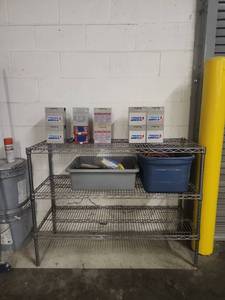lot 14524 image: Assorted Lot of Extension Cords, Batteries, Vacuum Bags and Shelving