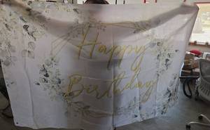 lot 465 image: Happy Birthday Fabric Banner with Floral Design and Gold Text - Retail $0