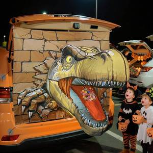 lot 64184 image: Halloween Trunk or Treat Car Decorations Kit, T-Rex Theme - Retail $50