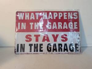 lot 5 image: What Happens in the Garage Stays in the Garage Metal Sign