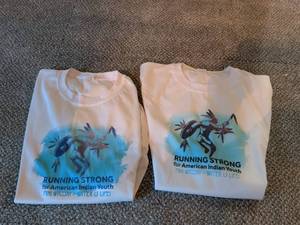 lot 284 image: Running Strong for American Indian Youth T-Shirts 2 Count Mni Wiconi Water is Life
