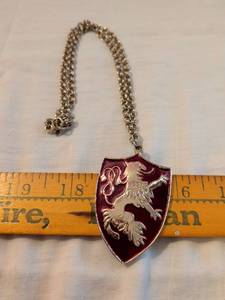 lot 392 image: Shield Pendant Necklace with Lion and Serpent Motif