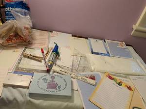 lot 432 image: Clothes, pins, notepads pens and pencils