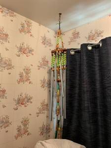 lot 546 image: Metal Wind Chime with Beaded Strands and Wooden Accents