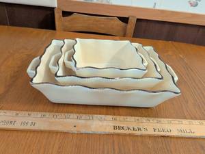 lot 552 image: 4-Piece Nesting Rectangular Baking Dishes with Wavy Brown Trim