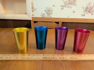 lot 554 image: Set of 4 Metal Tumblers Yellow Blue Purple Red