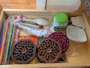 lot 610 image: Mixed Kitchen Drawer Lot Trivets Trivets Felt Pads Straws Stevia Thermometer Spoon Trivet