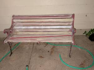 lot 877 image: Red and White Metal Slat Park Bench with Ornamental Armrests