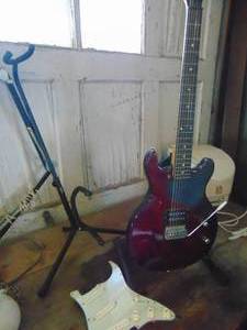 lot 3456 image: First Act electric guitar with stand and case