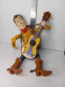 lot 38 image: Woody Toy Story Action Figure with Guitar
