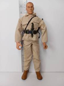 lot 69 image: Military Action Figure with Uniform Accessories and Rifle