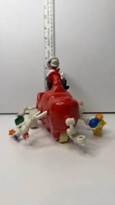 lot 91 image: Cat in the Hat Figure with Red Vehicle and Extending Arms Toy approximately 7 in