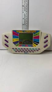 lot 113 image: Tiger Wheel of Fortune Handheld Electronic Game Cartridge