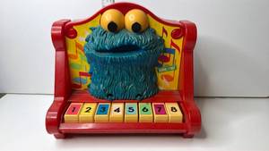 lot 118 image: Muppets Cookie Monster Piano Toy 1971 1976 Sesame Street