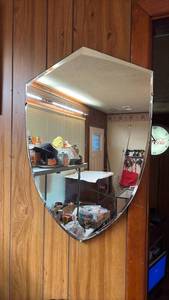 lot 1019 image: Shield-shaped wall mirror with beveled edges 25 inches tall peak to tip