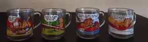 lot 3027 image: Vintage Garfield 4-Piece Glass Mug Set Jim Davis McDonalds