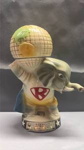 lot 2000 image: 1980 Jim Beam Republican Elephant decanter featuring the iconic GOP elephant holding a globe on its head.