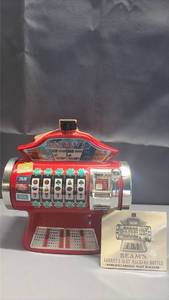 lot 2009 image: 1978 Jim Beam Barneys Casino slot machine ceramic whiskey decanter, modeled after the famous casino attraction in Lake Tahoe.