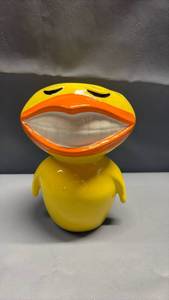 lot 4043 image: Peachtree Plaza Worlds Tallest Hotel Atlanta Georgia Souvenir Vase. Vintage 1979 John Todd ceramic yellow bird bud vase or planter featuring a wide, toothy grin.