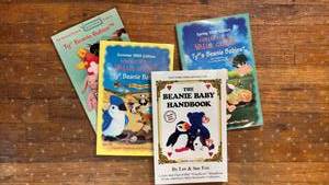 lot 5006 image: TY Beanie Babies Valuation Books and Heart Tag Protectors