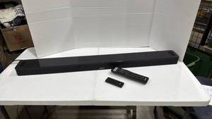 lot 1002 image: Bose 41 inch wide sound bar with 2 remote controls