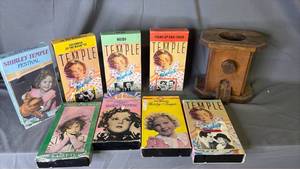 lot 267 image: 8 Shirley Temple VHS Tapes and wood peanut machine