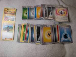 lot 561 image: Pokemon Trading Card Game Lot Energy Cards and Trainer Cards- approx. 100