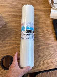 lot 396 image: rolled-up white Kahuna Grip bath and shower mat