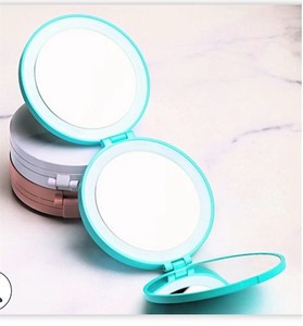 lot 404 image: Blushly Tri-Fold LED 1x5x 10x Magnification Compact Mirror    63