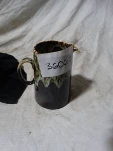 lot 36062 image: Brown decorative pitcher with teal highlight