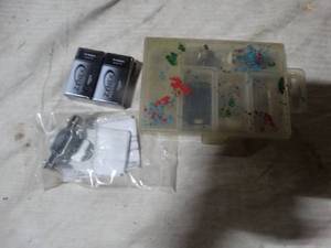 lot 36077 image: 2 Zynex medical D batteries, and cabinet latch hardware