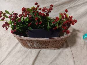 lot 36288 image: Artificial Flowers in a wooden basket, and a Wicker hanging wall decoration