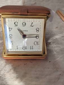 lot 36152 image: VIntage Equity Gold Vintage Travel alarm with built in case watch